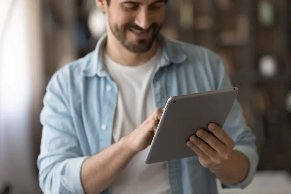 Man reviewing EDI information on tablet