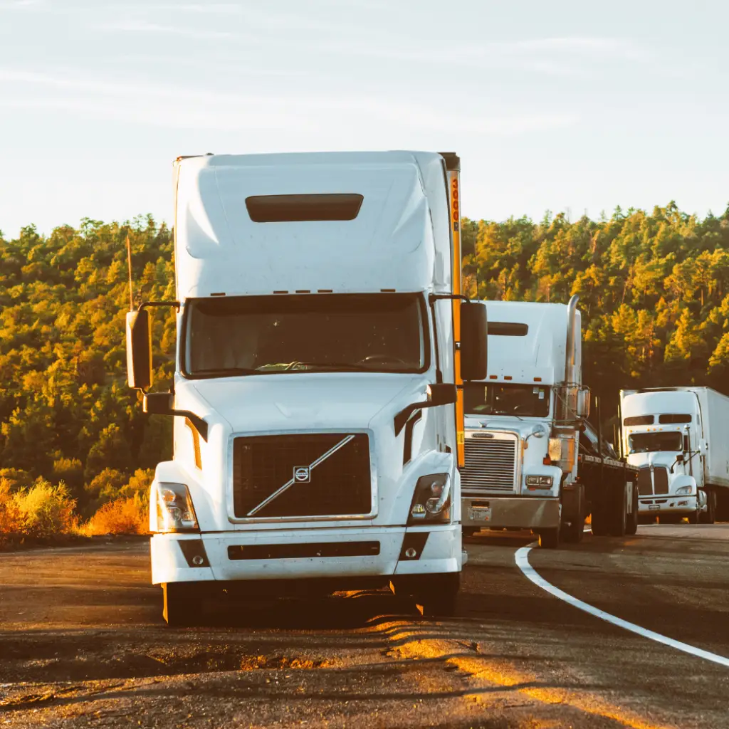 trucks driving through fields