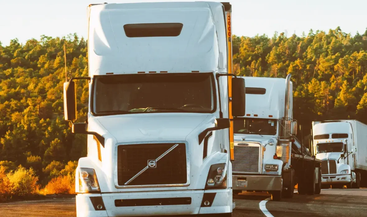 trucks driving through fields